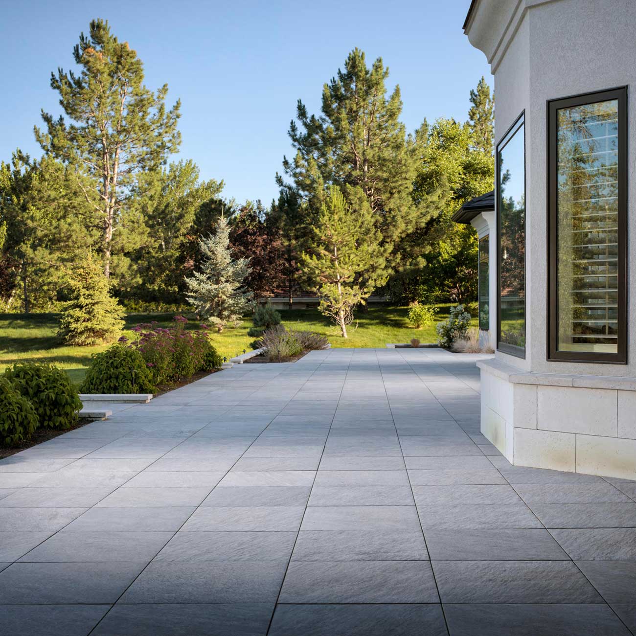 https://titanpavers.com/wp-content/uploads/2023/05/Porcelain-Paver-Patio-Quarziti.jpg